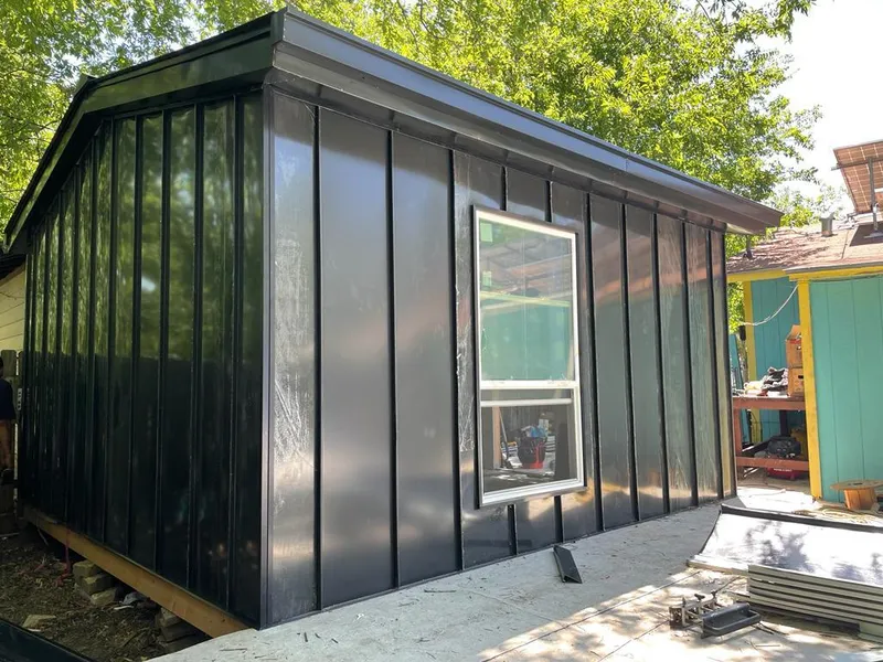 Black standing seam metal wall panels for Roof Inspection in Covina