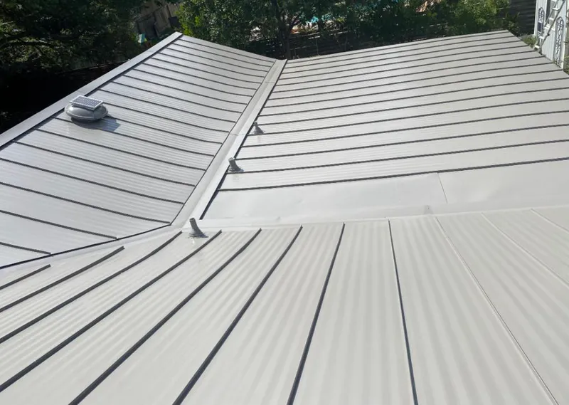 Solar attic fan installed on a metal roof for Roof Ventilation in Covina